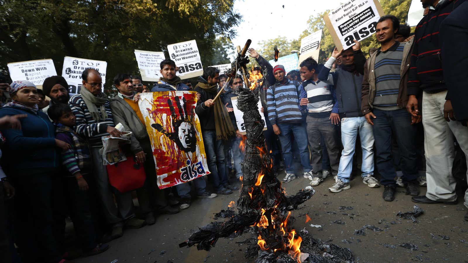 Foot in mouth turns to fire: Indian students burn an effigy representing Hindu nationalist leaders Asaram Bapu and Mohan Bhagwat. Bapu said the victim of the Delhi gang rape was equally responsible for the attack as her assailants. Bhagwat has said rape is an urban problem and that women are duty-bound to look after their husbands.