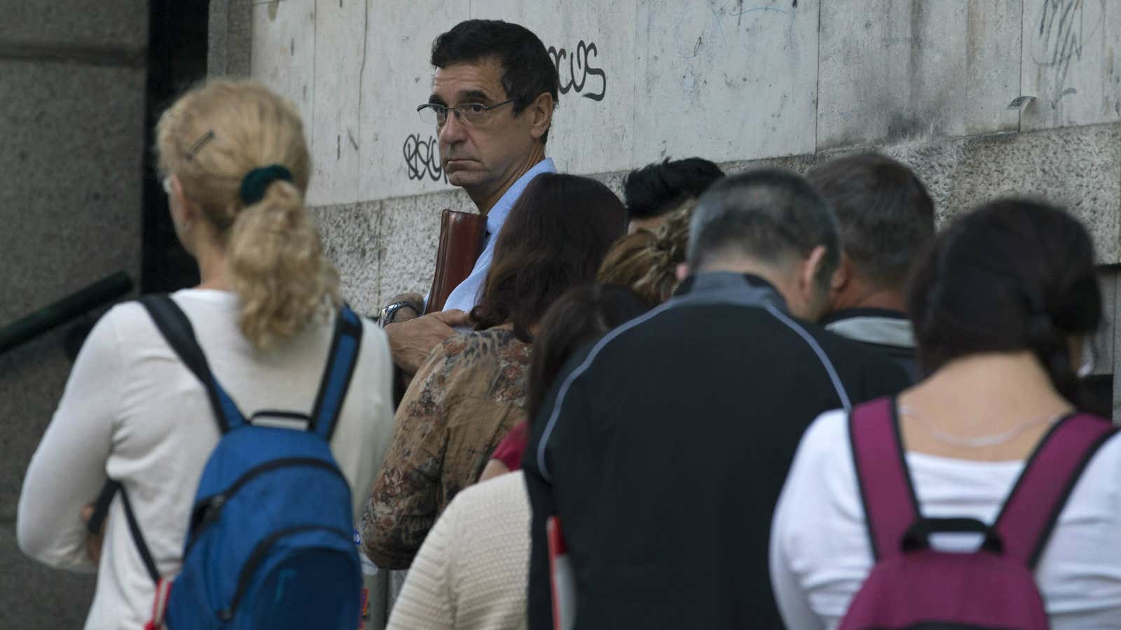 Spain’s unemployment line shows the ubiquity of workers affected.