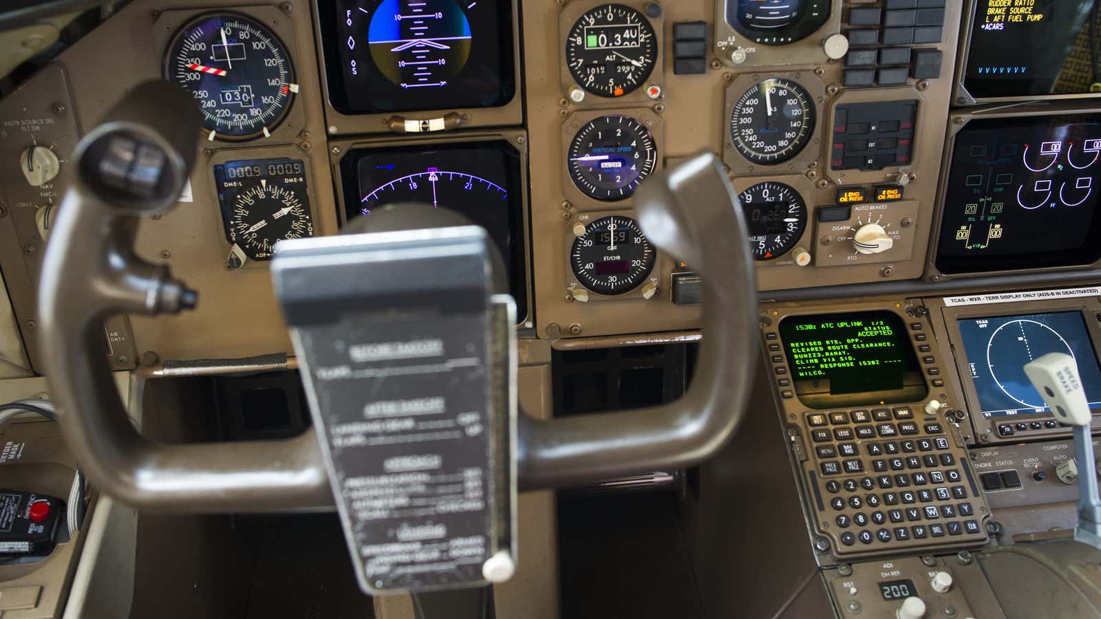 Data Communications Data Comm technology, lower right, is seen in the cockpit of an UPS Boeing 767-300F aircraft at Dulles International Airport Air Traffic Control…
