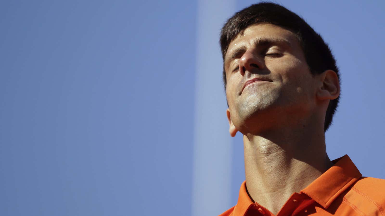 Serbia’s Novak Djokovic reacts after a point against Switzerland’s Stanislas Wawrinka during their men’s final match of the Roland Garros 2015 French Tennis Open in…