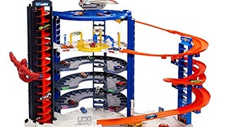 Hot Wheels Track Set with 4 1:64 Scale Toy Cars, Over 3-...