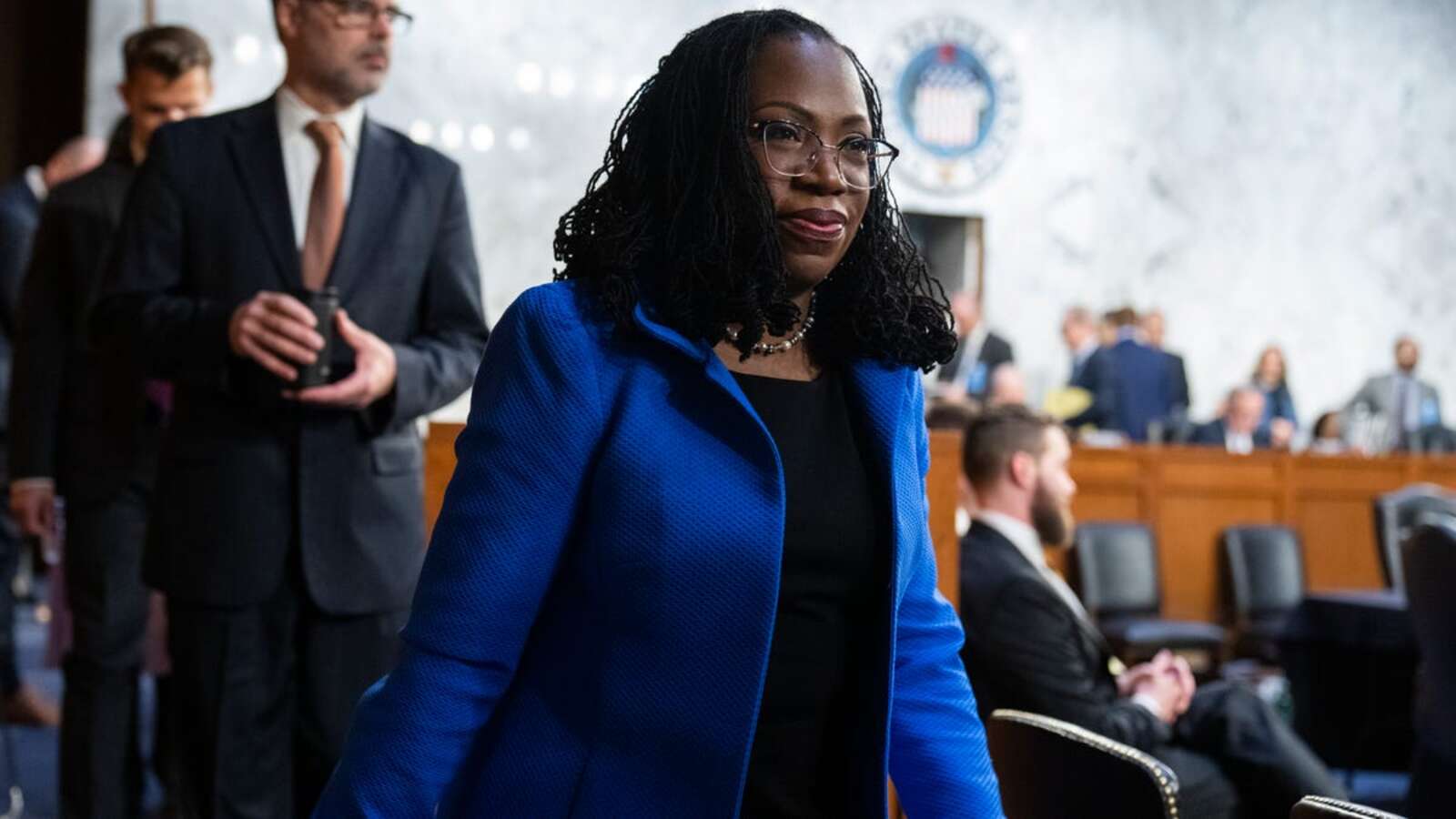 Judge Ketanji Brown Jackson, President Biden’s nominee for Associate Justice to the Supreme Court, arrives on the third day of her Senate Judiciary Committee confirmation hearing in Hart Senate Office Building on Capitol Hill, on Wednesday, March 23, 2022. Her husband Patrick Jackson appears at left.