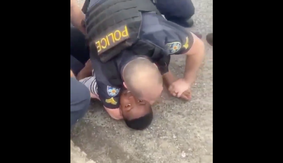 WATCH: Video appears to show Baton Rouge officer with arm around the neck of black teen WATCH: Video appears to show Baton Rouge officer with arm around the neck of black teen