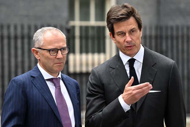 Formula One Group CEO Stefano Domenicali (left) and Mercedes F1 team principal Toto Wolff speak to the press during a visit to Downing Street in London on July 4, 2023 ahead of the British Grand Prix.