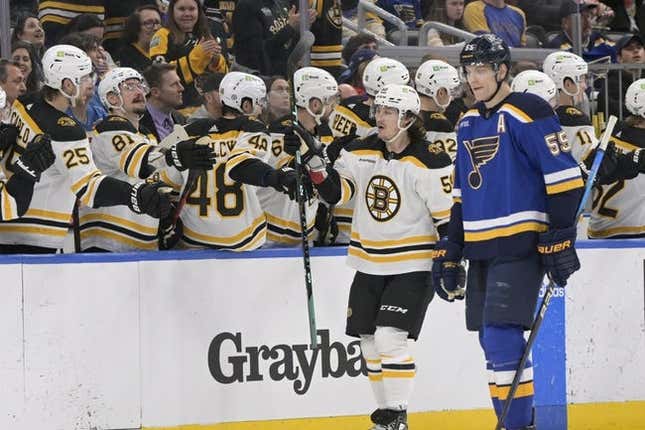 Apr 2, 2023; St. Louis, Missouri, USA; Boston Bruins left wing Tyler Bertuzzi (59) is congratulated by teammates after scoring a goal against the St. Louis Blues during the second period at Enterprise Center.
