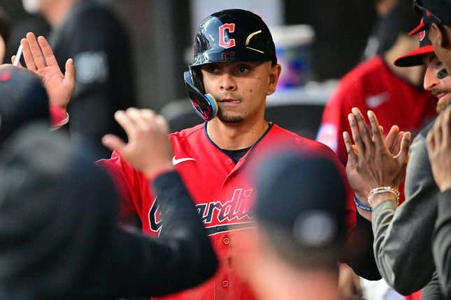 Aug 22, 2023; Cleveland, Ohio, USA; Cleveland Guardians second baseman Andres Gimenez (0) celebrates after scoring during the fourth inning against the Los Angeles Dodgers at Progressive Field.
