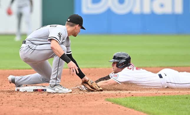 Aug 6, 2023; Cleveland, Ohio, USA;  Cleveland Guardians center fielder Myles Straw (7) is caught stealing by Chicago White Sox second baseman Zach Remillard (28) during the third inning at Progressive Field.