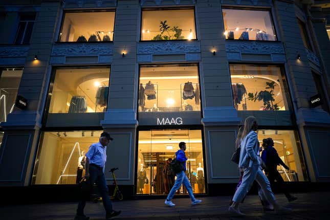 People walk past a newly opened Maag store, a former Zara flagship store, in Moscow, Russia, Monday, Aug. 21, 2023. Life seems normal in many ways despite sweeping sanctions – outdoor seating at restaurants and bars is packed and malls are still operating, though stores like Zara and H&amp;M have been replaced by new clothing brands Maag and Vilet. (AP Photo/Alexander Zemlianichenko)
