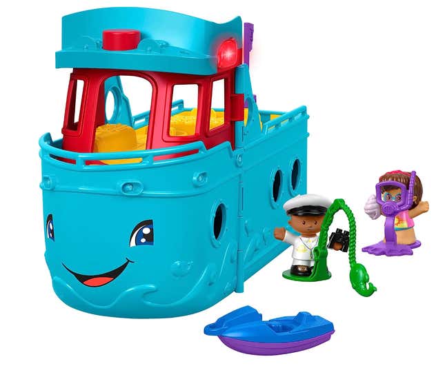 A Fisher Price boat toy with two Little People figures. The boat has a face and a terrifying smile.