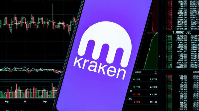 A phone with the kraken logo in front of a screen bearing financial data