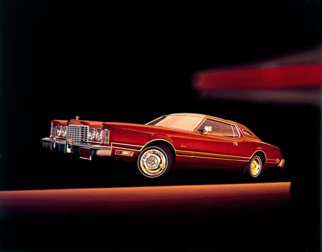 A red 1975 Ford Thunderbird photographed in studio