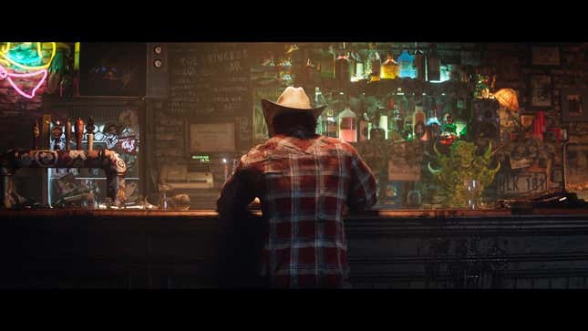 Wolverine sits at a bar, wearing a cowboy hat. 