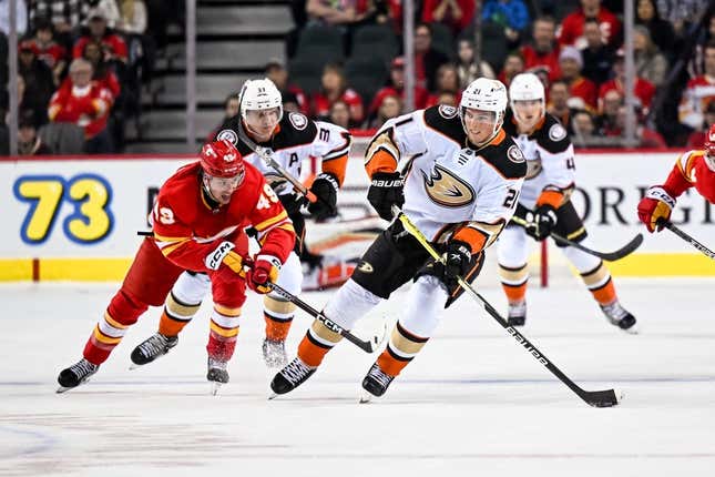Mar 10, 2023; Calgary, Alberta, CAN; Calgary Flames left wing Jakob Pelletier (49) skates after Anaheim Ducks center Isac Lundestrom (21) during the first period at Scotiabank Saddledome.