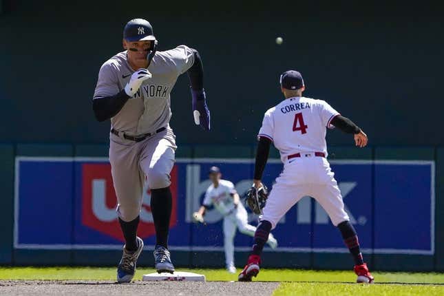 Apr 26, 2023; Minneapolis, Minnesota, USA; New York Yankees designated hitter Aaron Judge (99) runs to third on a sacrifice fly against the Minnesota Twins during the first inning at Target Field.