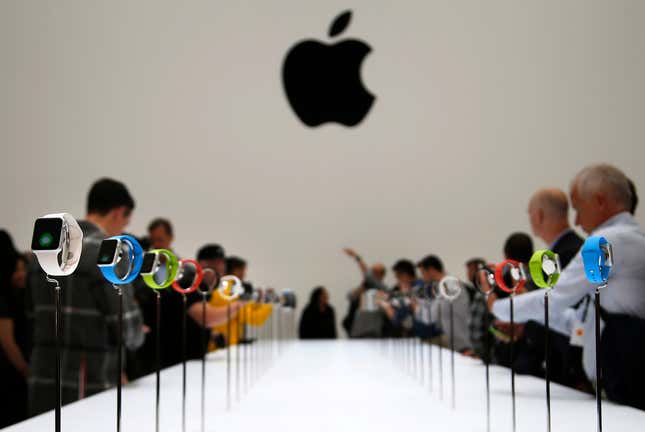 Members of the media look at the Apple Watch during an Apple event in Cupertino, California.