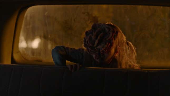 An infected child climbs into a car seat.