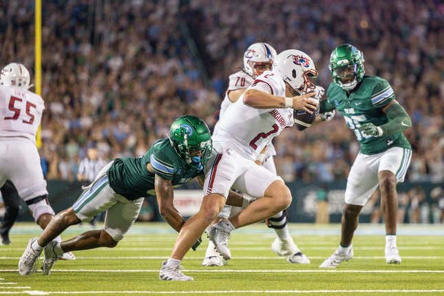 Sep 2, 2023; New Orleans, Louisiana, USA;  South Alabama Jaguars quarterback Carter Bradley (2) scrambles out the pocket to avoid the sack of Tulane Green Wave safety Kam Pedescleaux (8) during the first half at Yulman Stadium.