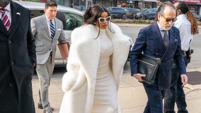 Cardi B, center, arrives at Queens Court after not meeting her requirements for her misdemeanor guilty plea on January 17, 2023 in New York City.