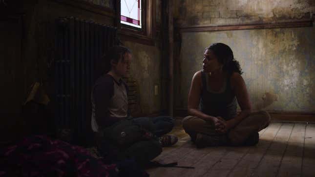 Ellie and Marlene sit on the floor in a scene from HBO's The Last of Us.