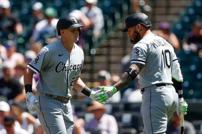 August 20, 2023;  Denver, Colorado, United States;  Chicago White Sox designated hitter Andrew Vaughn (25) celebrates his solo home run with third baseman Yoan Moncada (10) in the second inning against the Colorado Rockies at Coors Field.
