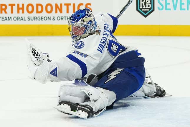 Mar 28, 2023; Raleigh, North Carolina, USA;  Tampa Bay Lightning goaltender Andrei Vasilevskiy (88) makes a glove save against the Carolina Hurricanes during the first period at PNC Arena.
