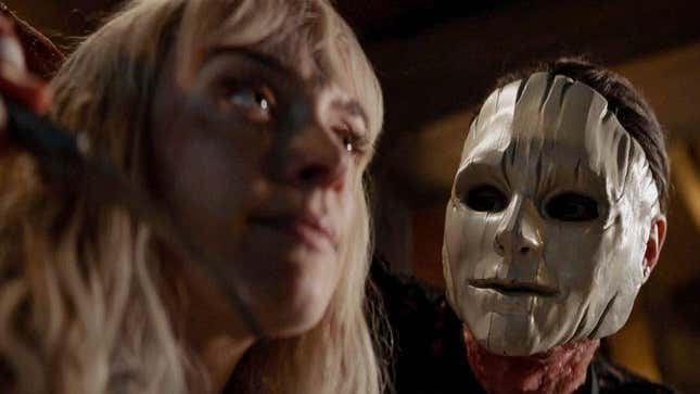 Batwoman's Rachel Skarsten is held captive by new arrival Wallis Day in a creepy wood mask.