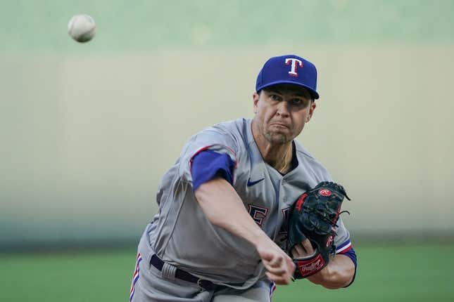 Apr 17, 2023; Kansas City, MO, USA; Texas Rangers starting pitcher Jacob deGrom (48) throws a warm-up pitch against the Kansas City Royals at Kaufman Stadium.