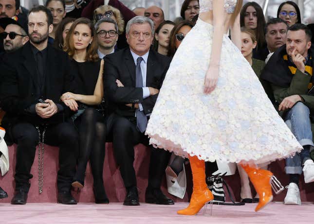 Actress Natalie Portman (2ndL), her husband Benjamin Millepied and Sidney Toledano (R), Chief Executive of Christian Dior attend Belgian designer Raf Simons Haute Couture Spring Summer 2015 fashion show for French fashion house Christian Dior in Paris January 26, 2015. REUTERS/Gonzalo Fuentes (FRANCE - Tags: FASHION ENTERTAINMENT) - RTR4MZRK
