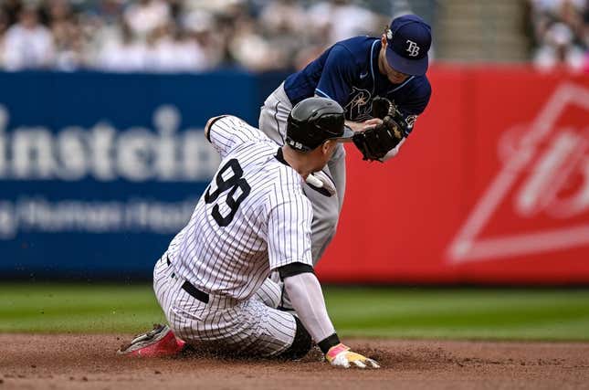 May 13, 2023; Bronx, New York, USA; Tampa Bay Rays second baseman Taylor Walls (6) forces out New York Yankees center fielder Aaron Judge (99) at second base at Yankee Stadium.