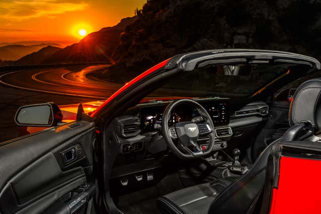 The interior of the 2024 Ford Mustang GT watching the sun set over Angeles Crest Highway in Los Angeles, California.