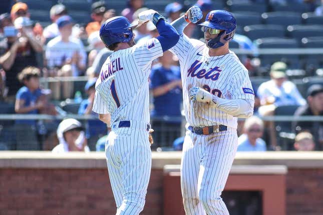 Sep 3, 2023; New York City, New York, USA;  New York Mets first baseman Pete Alonso (20) is greeted by left fielder Jeff McNeil (1) after hitting a two run home run in the third inning against the Seattle Mariners at Citi Field.