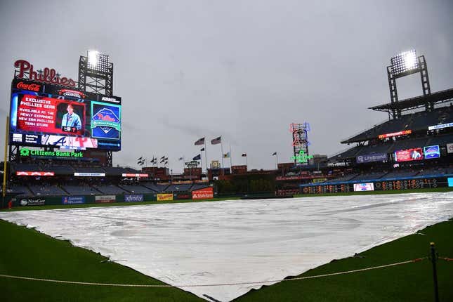 Jun 21, 2023; Philadelphia, Pennsylvania, USA; Tarp covers the infield during rain delay before start of game Philadelphia Phillies and Atlanta Braves at Citizens Bank Park.