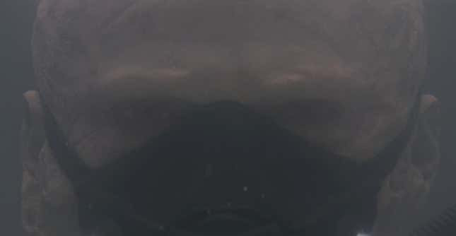 A burned vader in a tank with a mask on