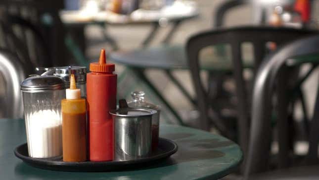Condiments on diner table outdoors