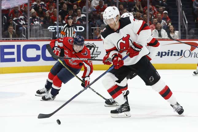 Apr 13, 2023; Washington, District of Columbia, USA; New Jersey Devils defenseman Dougie Hamilton (7) skates with the puck as Washington Capitals left wing Conor Sheary (73) chases in the first period at Capital One Arena.