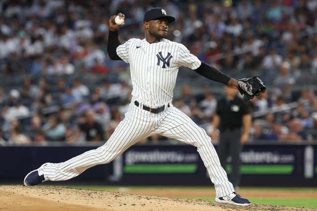 Jul 31, 2023; Bronx, New York, USA; New York Yankees starting pitcher Domingo German (0) delivers a pitch during the seventh inning against the Tampa Bay Rays at Yankee Stadium.