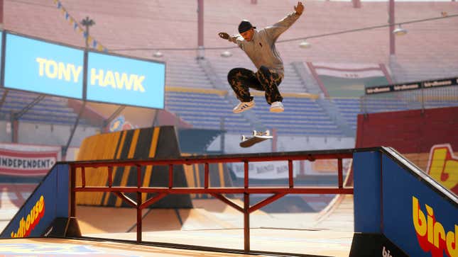 An image from Tony Hawk's Pro Skater 1 + 2 depicting a skateboarder doing a kickflip over a handrail at Tony Hawk's Birdhouse skatepark.