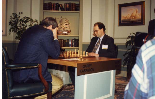 Kasparov hangs his head in his hands during a chess game with Deep Blue.