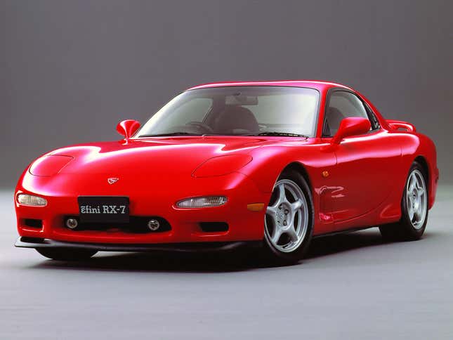 Mazda press image of a red FD RX-7 viewed from the front quarter.