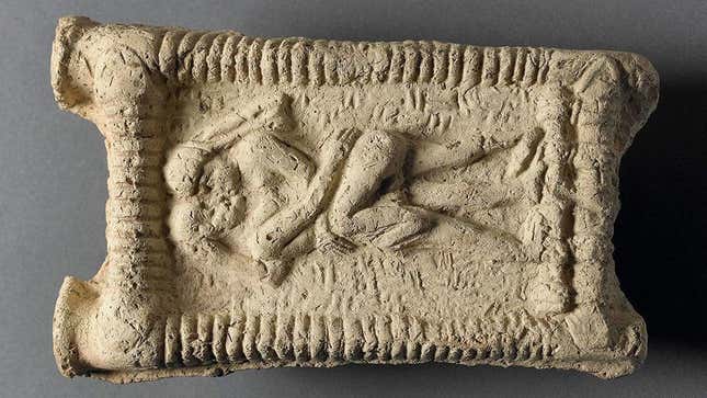 A Babylonian tablet depicting a naked couple kissing, dated 1800 BCE. 