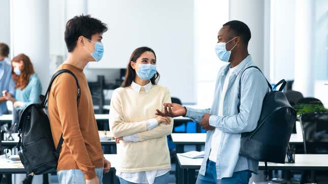 teens chatting with masks on