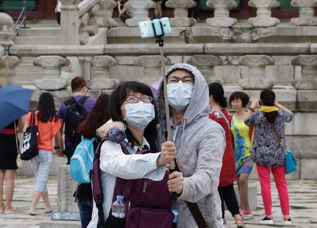 A couple at Gyeongbok Palace in Seoul.