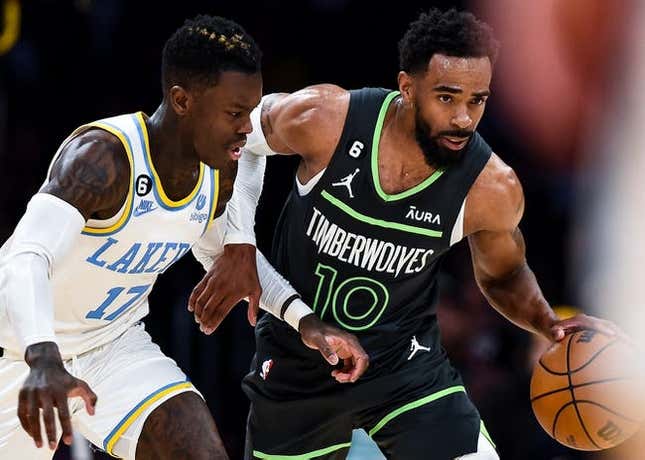 Mar 3, 2023; Los Angeles, California, USA; Minnesota Timberwolves guard Mike Conley (10) moves the ball against Los Angeles Lakers guard Dennis Schroder (17) during the second quarter at Crypto.com Arena.