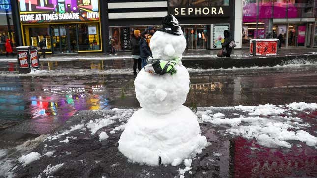 NEW YORK, NY - JANUARY 07: A snowman is seen as snowfall blankets the Times Square on January 7, 2022