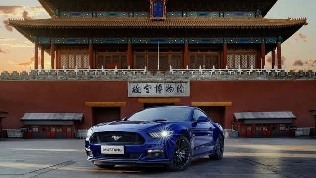 A photo of a blue Mustang muscle car. 