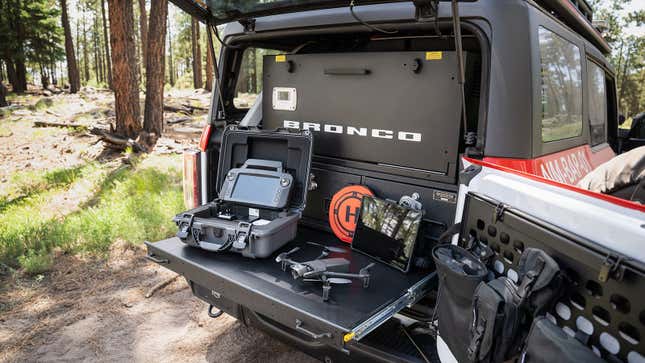 A photo of a tree trunk in the firefighting Bronco and its drones.