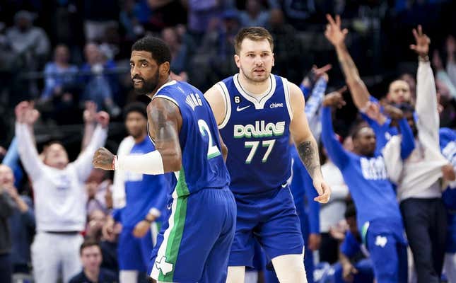 Feb 13, 2023; Dallas, Texas, USA;  Dallas Mavericks guard Kyrie Irving (2) celebrates with Dallas Mavericks guard Luka Doncic (77) during the fourth quarter against the Minnesota Timberwolves at American Airlines Center.