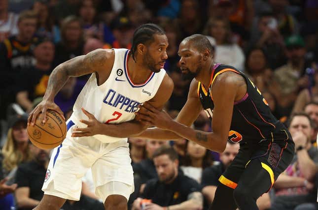 Apr 18, 2023; Phoenix, Arizona, USA; Los Angeles Clippers forward Kawhi Leonard (2) controls the ball against Phoenix Suns forward Kevin Durant (35) in the second half during game two of the 2023 NBA playoffs at Footprint Center.