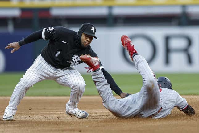 May 2, 2023; Chicago, IL, USA; Minnesota Twins left fielder Trey Flanach (9) is defended by Chicago White Sox shortstop Elvis Andrews (1) in the fourth inning. ) to steal second base.