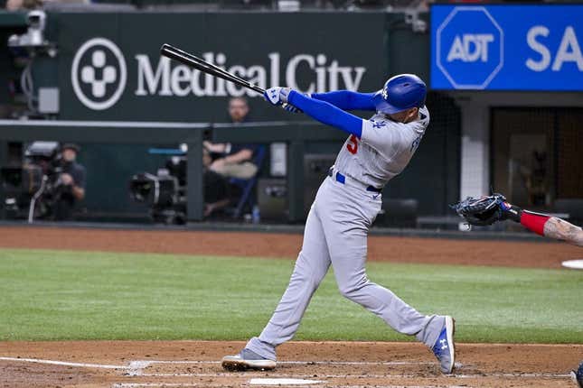 Jul 21, 2023; Arlington, Texas, USA; Los Angeles Dodgers first baseman Freddie Freeman (5) hits a double and drives in two runs against the Texas Rangers during the third inning at Globe Life Field.